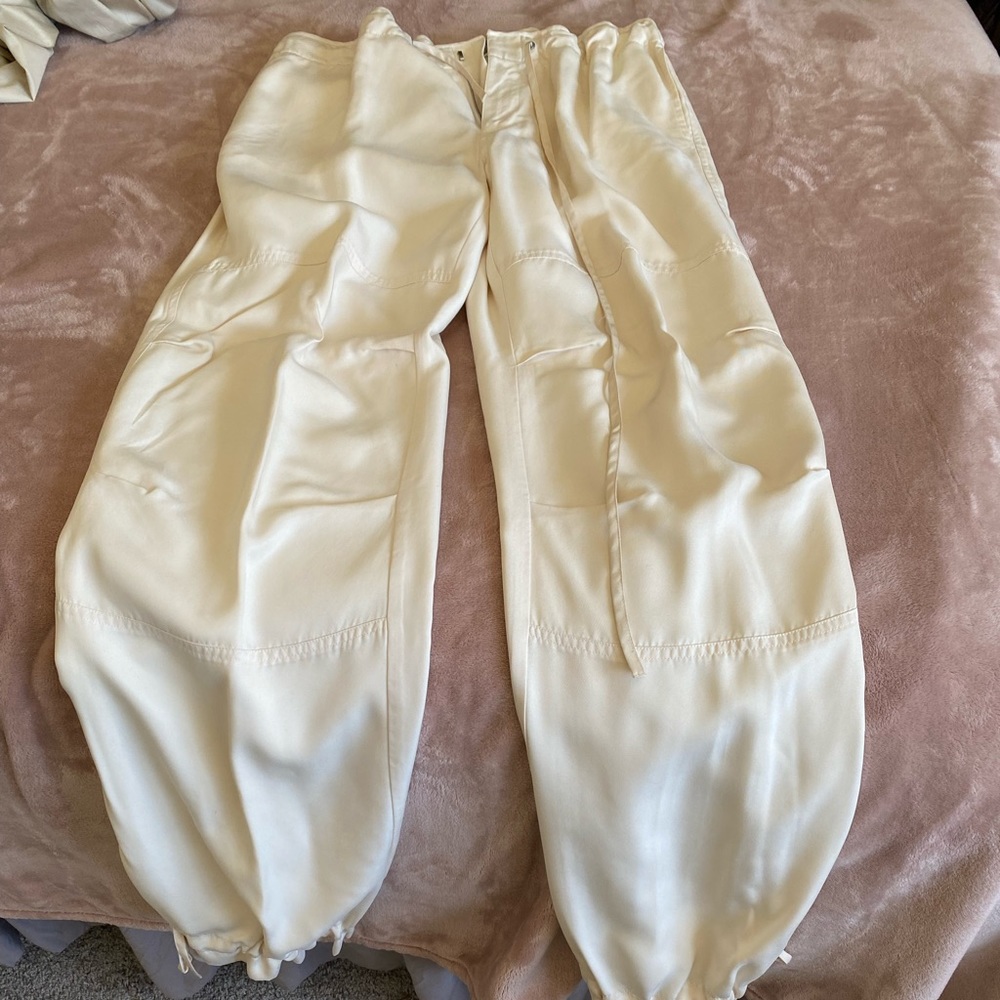 Silk crème pants with drawstrings at waist and at legs